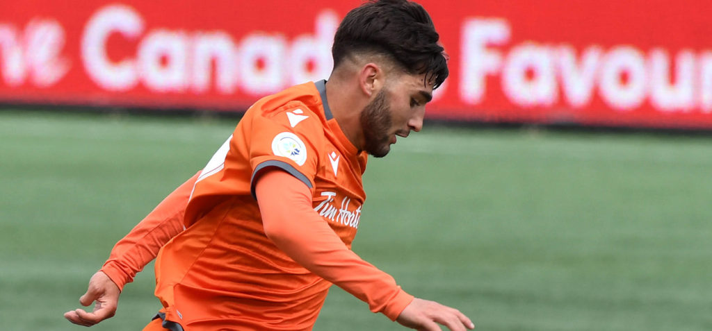 Forge midfielder Tristan Borges dribbles the ball past York9's Manny Aparicio in the second half of the CPL's inaugural match at Tim Hortons Field. (Dan Hamilton-USA TODAY Sports for CPL)