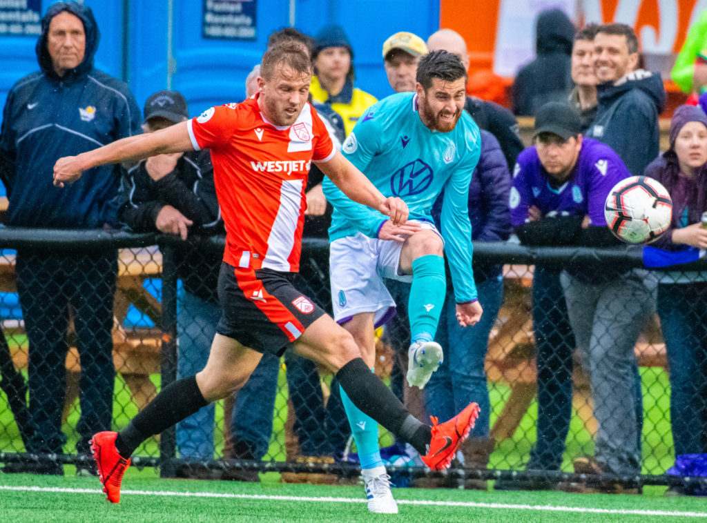 Cavs' Nico Pasquotti battles for the ball with Pacific's Blake Smith. (Pacific FC)