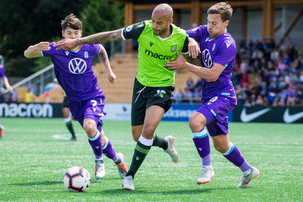 Pacific FC's Kadin Chung (L) and Ben Fisk (R) battle wiYork9's Kyle Porter (C) at Westhills Stadium. (Photo courtesy Pacific FC).