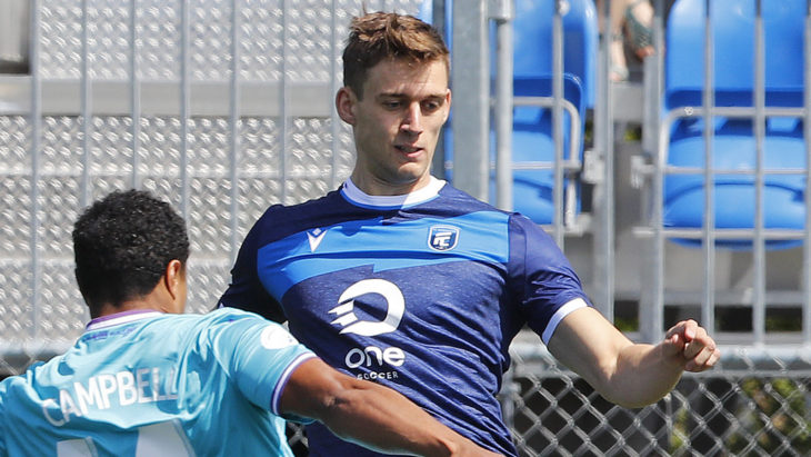 May 12, 2019; Edmonton, Alberta, CAN; Pacific FC midfielder Terran Campbell (14) defends a pass by FC Edmonton defender Amer Didic (55) during a Canadian Premier League soccer match at Clarke Stadium. Mandatory Credit: Perry Nelson-USA TODAY Sports for CPL