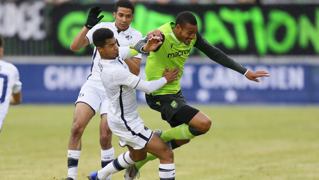 York9 FC attacker Simon Karlsson Adjei and A.S. Blainville defender Nafi Dicko-Raynauld battle for the ball during the first half of the Canadian Championship soccer match at York Lions Stadium. (John E. Sokolowski-USA TODAY Sports for CPL)