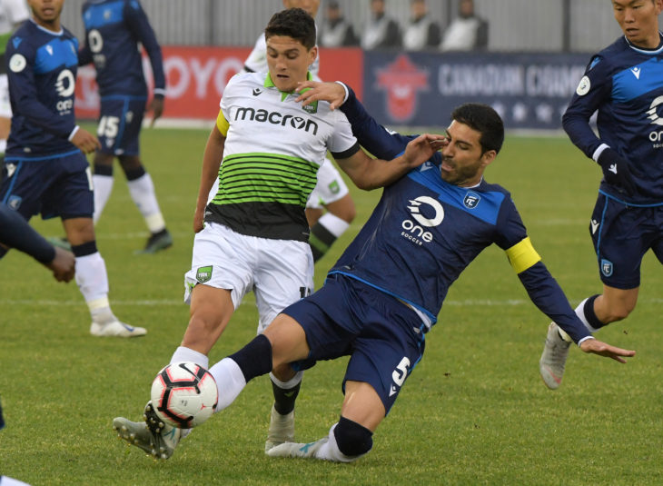 York9 midfielder Manuel Apricio (10) battles for the ball with FC Edmonton defender Ramon Soria Alonso (5) in the first half of a Canadian Championship soccer match at York Lions Stadium. (Photo: Dan Hamilton-USA TODAY Sports for CPL)