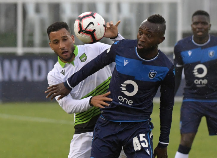 Jun 5, 2019; York, Ontario, CAN; FC Edmonton forward Oumar Diouck (45) battles for the ball with York 9 defencer Morey Doner (3) in the first half of a Canadian Championship soccer match at York University Field. Mandatory Credit: Dan Hamilton-USA TODAY Sports for CPL