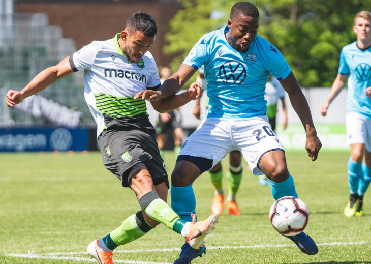 York9's Rodrigo Gattas and HFX's Zela Langwa battle for the ball at York Lions Stadium. (Photo: Chant.ca).