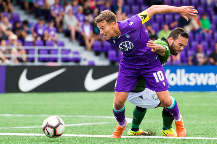 Pacific's Ben Fisk battles for the battle against Cavalry FC's Sergio Camargo at Westhills Stadium. (Photo: Pacific FC/Reuters).