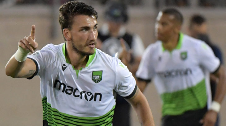 York9 defender Luca Gasparotto (13) reacts after a goal against Montreal Impact by forward Rodrigo Gattas (not shown). (Photo: Dan Hamilton-USA TODAY Sports for CPL)