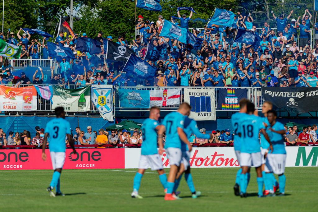 The Kitchen celebrates an HFX Wanderers victory. (Trevor MacMillan/CPL).