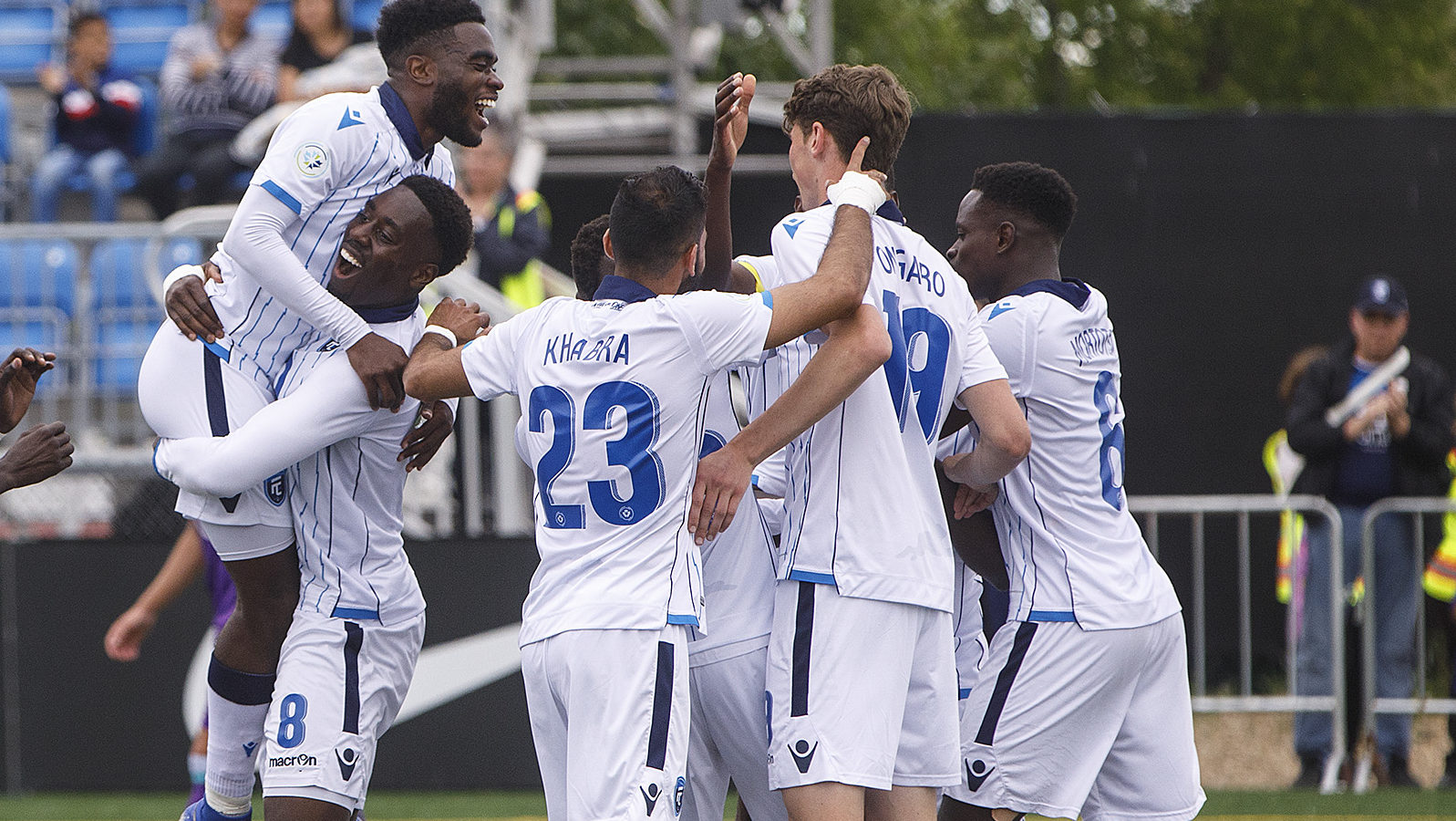 Easton Ongaro celebrates with FC Edmonton teammates. (CPL/Jason Franson).