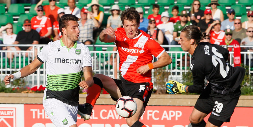 Cavalry battles for the ball vs. York9 FC at Spruce Meadows. (Photo: Tony Lewis/CPL).