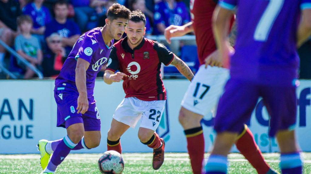 Pacific FC's Alessandro Hojabrpour controls possession against Valour FC's Marco Bustos. (Pacific FC/CPL).