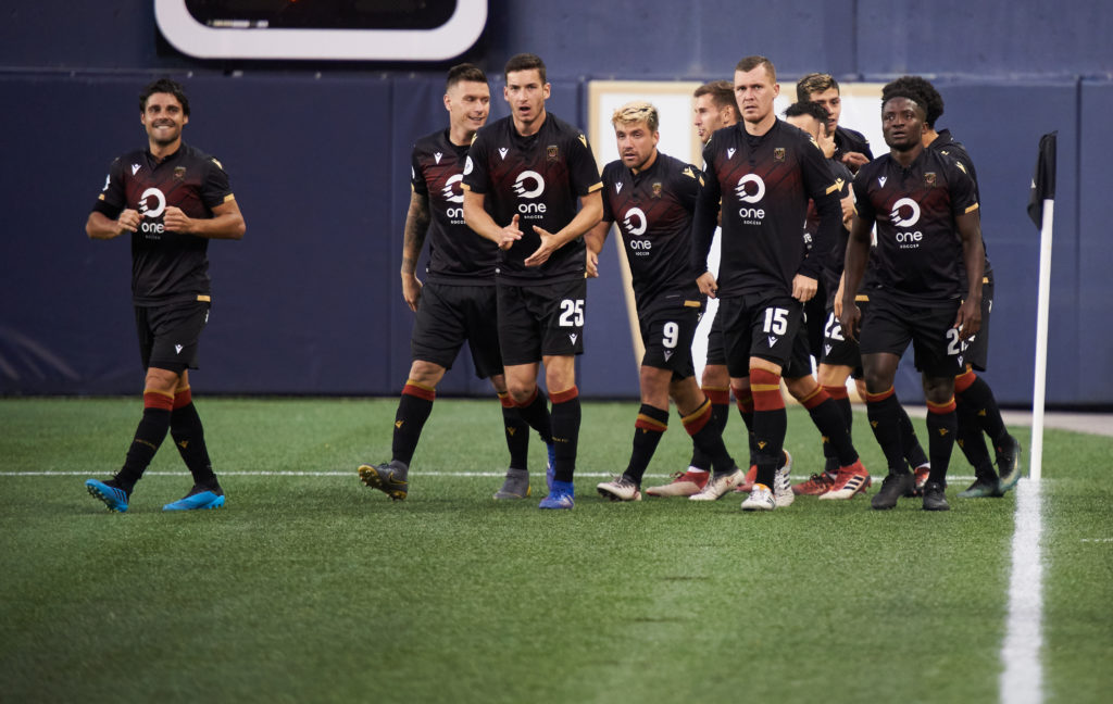 Valour players celebrate Marco Bustos' goal. (Photo: Valour FC).