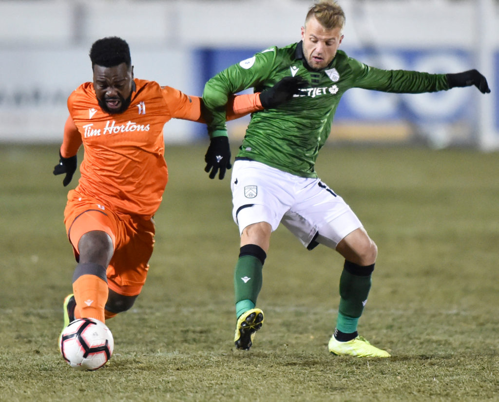 Dominic Samuel of Forge FC and Nico Pasquotti of Cavalry FC vie for the ball. Mike Sturk/CPL