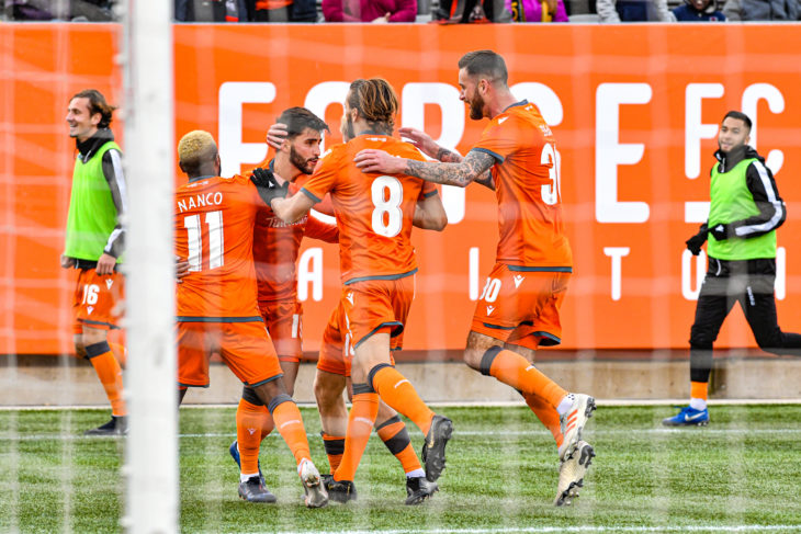 Forge FC players converge on Tristan Borges after his first-half goal put them 1-0 up on Cavalry FC. (Photo: CPL)