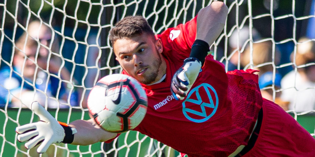 Canadian Premier League - HFX Wanderers FC vs FC Edmonton - Wanderers Grounds, Halifax, Nova Scotia - September 28, 2019. HFX Wanderers FC Goalkeeper Christian Oxner (50) dives to make a save. (Trevor MacMillan/CPL)