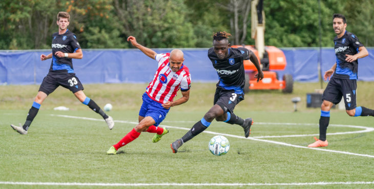 Ottawa's Francisco Acuña surrounded by FC Edmonton players. (CPL/Chant Photography)