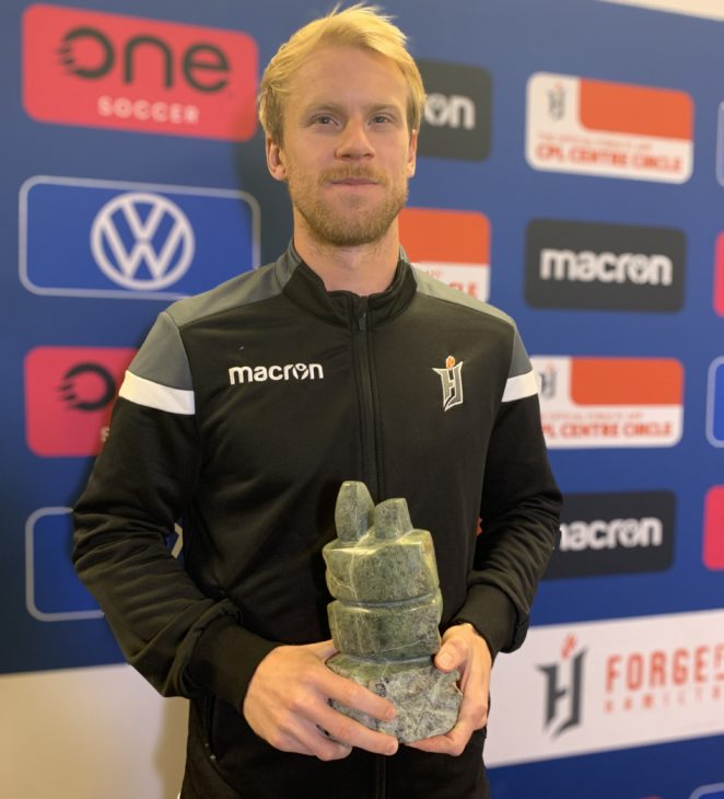 Forge FC's Kyle Bekker with the 2020 CPL Player of the Year award. (CPL photo)