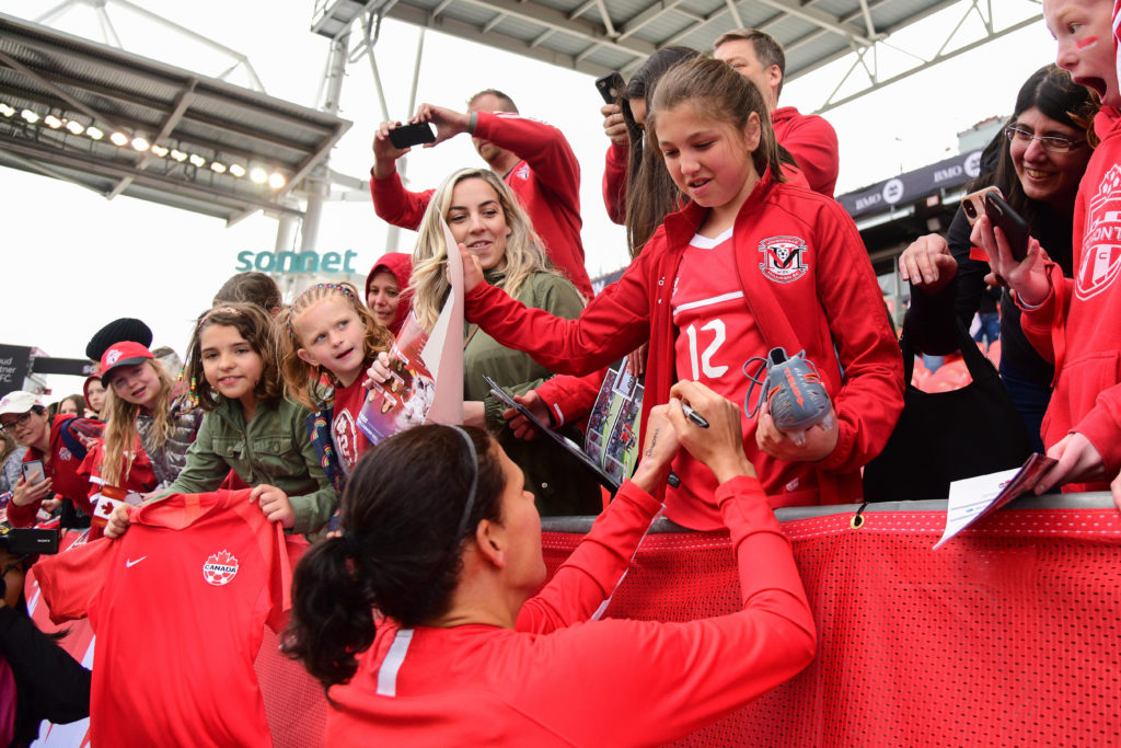 Christine Sinclair signing autographs for fans (Photo: Canada Soccer by Martin Bazyl)