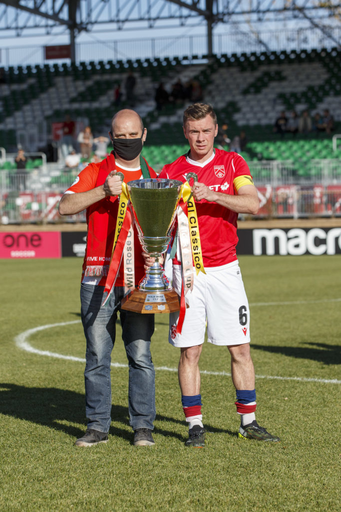 Cavalry FC captain Nik Ledgerwood receives the Wild Rose Cup (CPL/Tony Lewis)