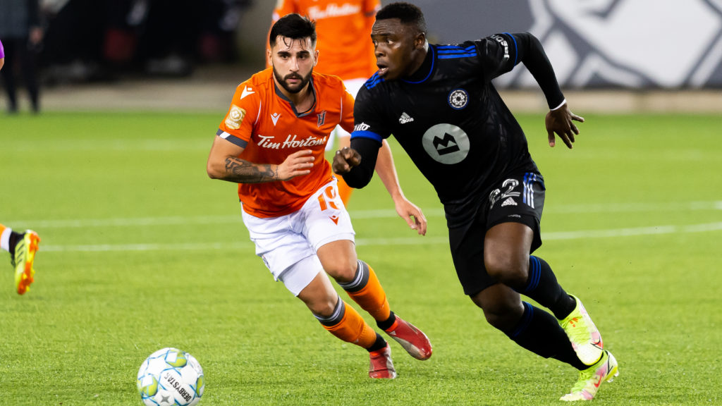 Forge FC attacker Tristan Borges chases CF Montreal's Ibrahim Sunusi (Ryan McCullough/Hamilton Forge FC)