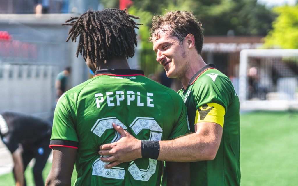 Aribim Pepple and Mason Trafford after Pepple's goal vs. York United. (David Chant/York United)