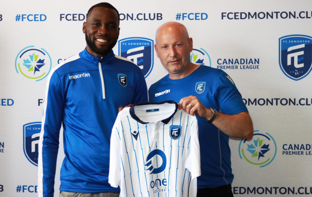 Tony Tchani and FC Edmonton head coach Jeff Paulus.